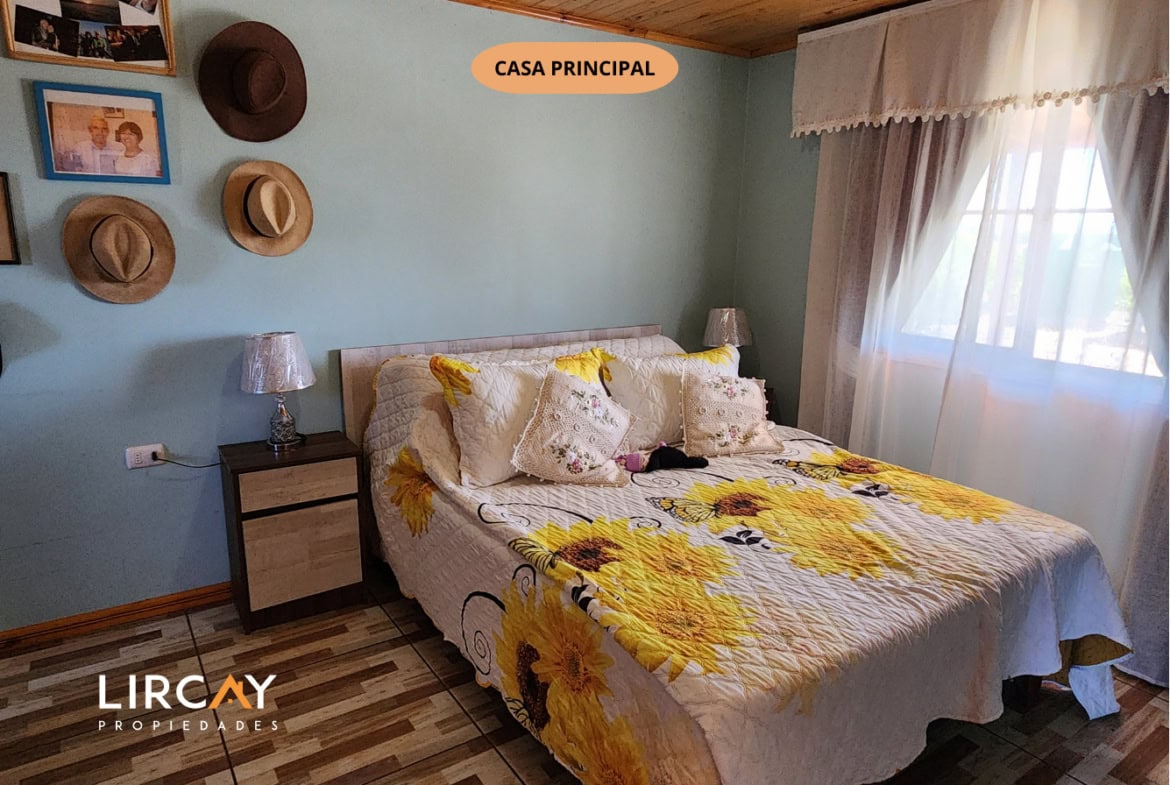 Parcela de 5.000 m² en San Rafael con Dos Casas Construidas y Terreno Plano