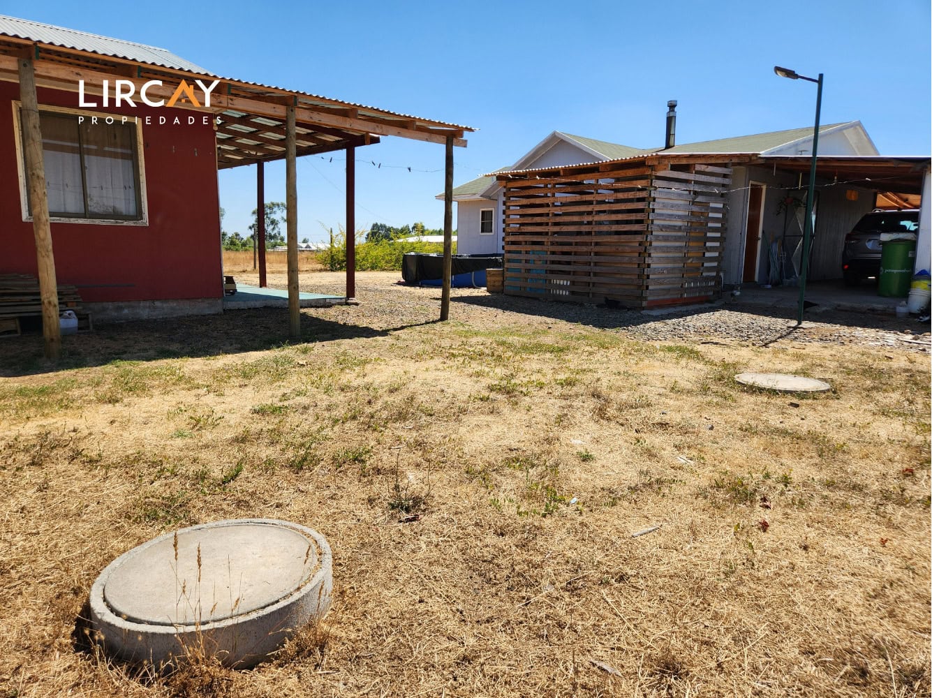 Parcela de 5.000 m² en San Rafael con Dos Casas Construidas y Terreno Plano